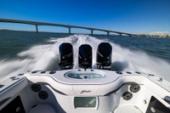 Stern of the Yellowfin 36 Offshore with three outboards at speed