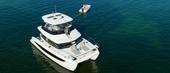 Aerial view of the Aquila 42 Yacht at anchor with its tender