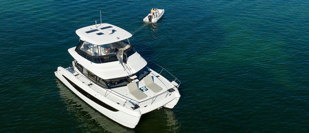 Aerial view of the Aquila 42 Yacht at anchor with its tender