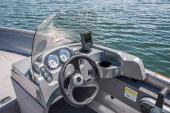 Crestliner 1600 Vision helm console with steering wheel and gauges