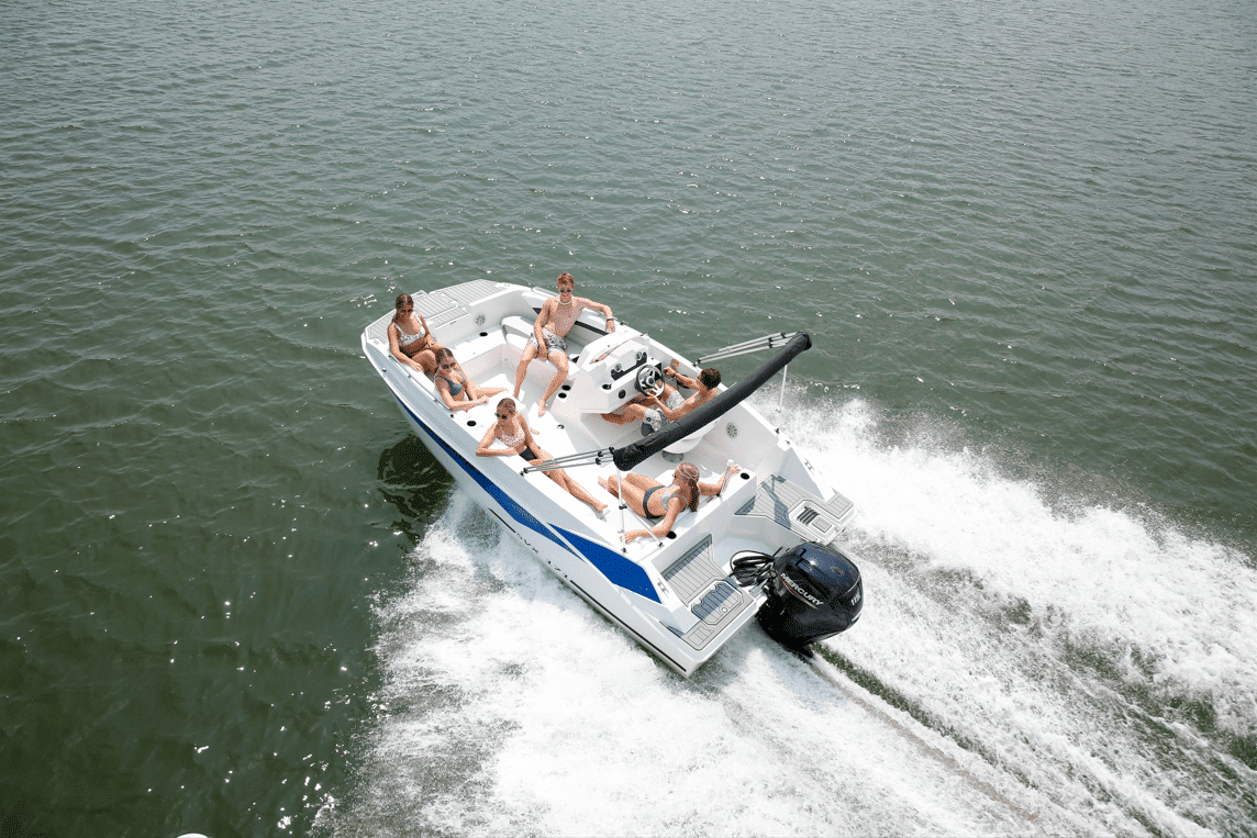 Aerial view of the Starcraft SVX 171 OB at speed with passengers seated on the open deck and an outboard on the transom