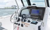 Bertram 28CC helm with multifunction display, wheel and digital controls