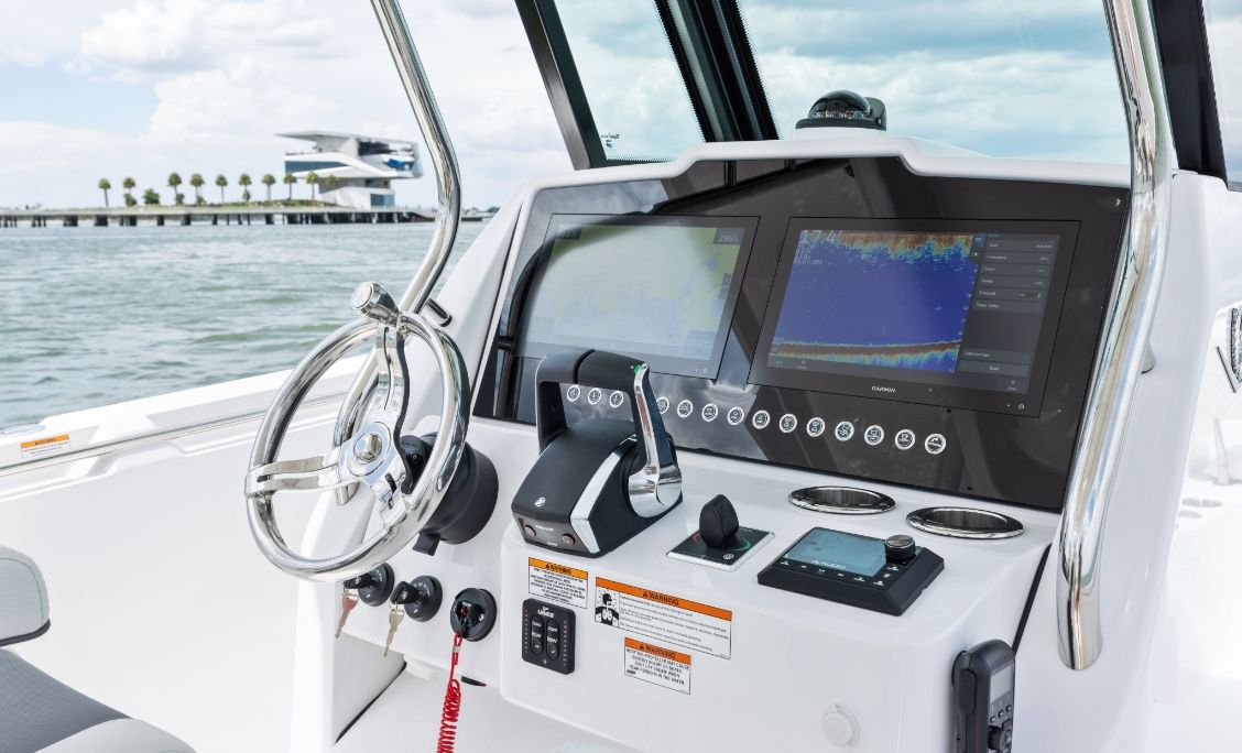 Bertram 28CC helm with multifunction display, wheel and digital controls
