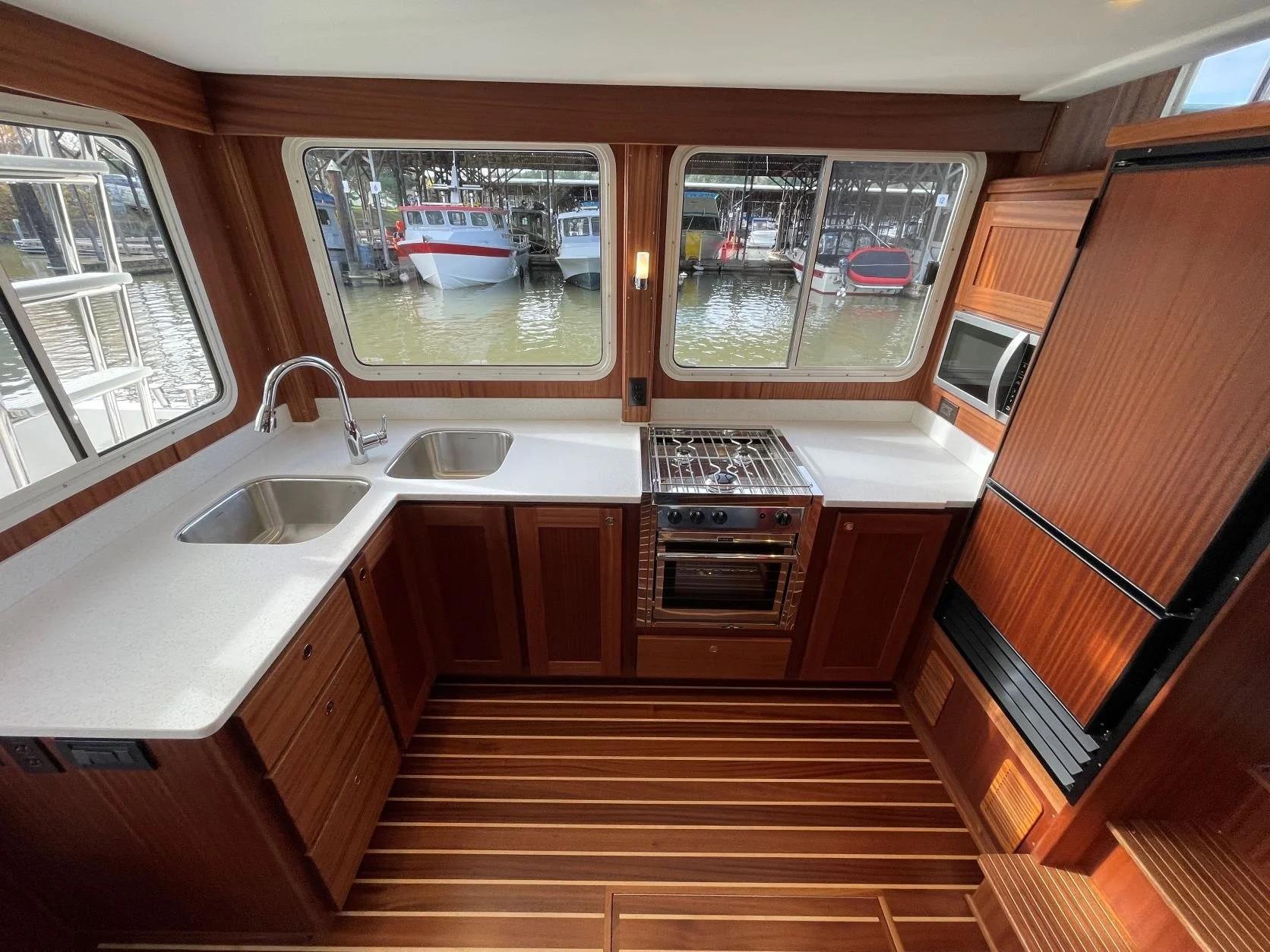 American Tug 362 galley with sapele cabinetry