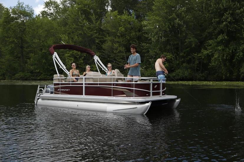 Starcraft LX 22 R pontoon on calm water with passengers aboard