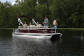 Starcraft LX 22 R pontoon on calm water with passengers aboard