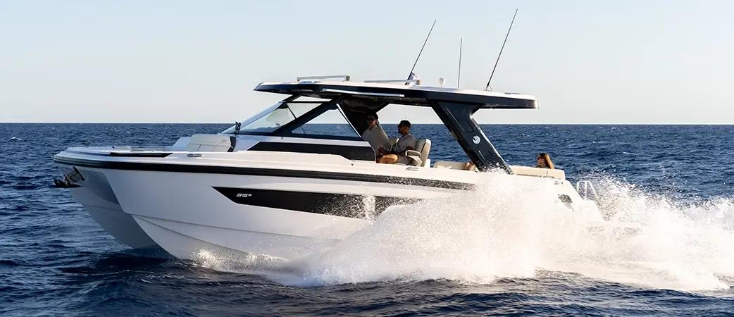 Aquila 35 Sport running along the coast with guests aboard