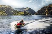 Kawasaki Ultra 310X 2025 jet ski, three-quarter front angle of a rider on a lake