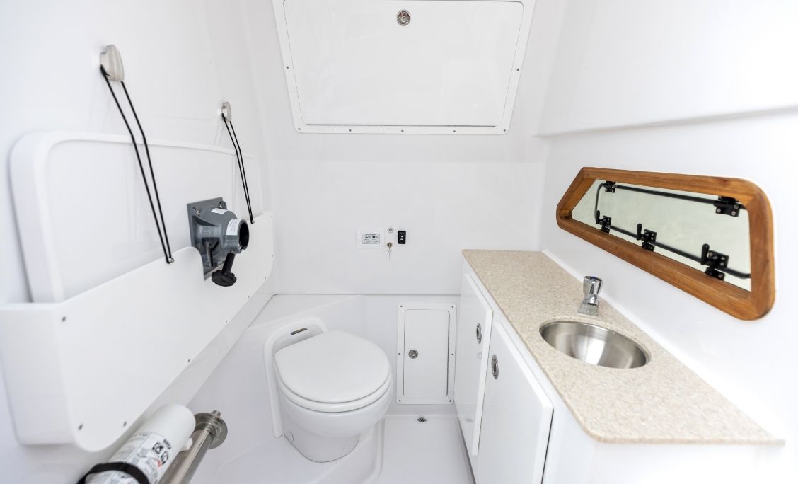 Bertram 28CC console head with toilet, vanity and sink