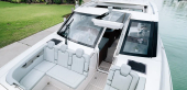 Sheltered bow lounge of the Aquila 46 Coupe with forward-facing seats and opening carbon hatch