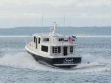 American Tug 365 running at speed, stern quarter view