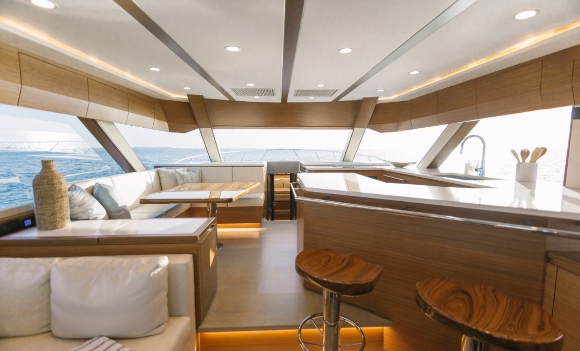 Bertram 61 Convertible salon with lounge, dinette and open galley