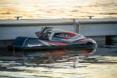 Kawasaki Jet Ski SX-R 160 parked near a dock, side angle