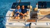 Couple relaxing in the Aquila 36 Sport forward cockpit
