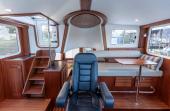 American Tug 435 pilothouse with helm chair and settee