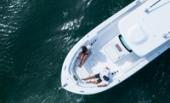 Bertram 28CC aerial view of the bow seating with guests relaxing
