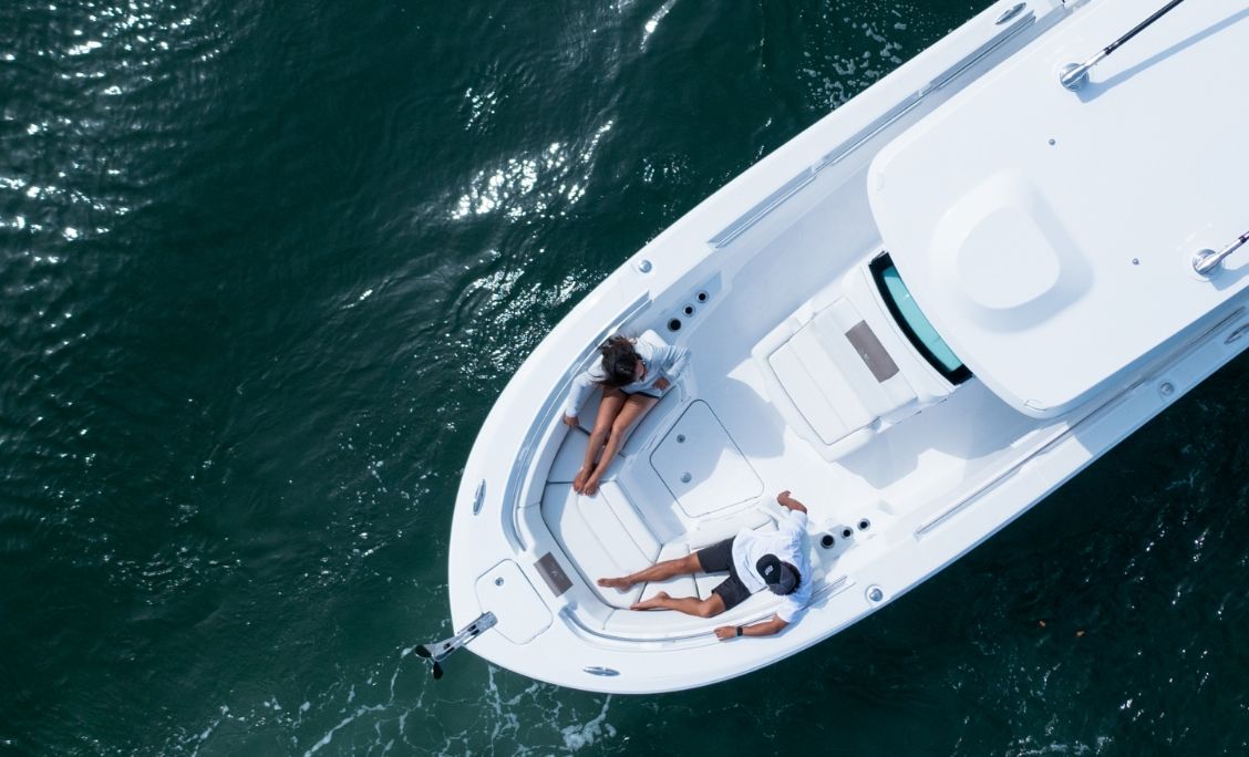 Bertram 28CC aerial view of the bow seating with guests relaxing