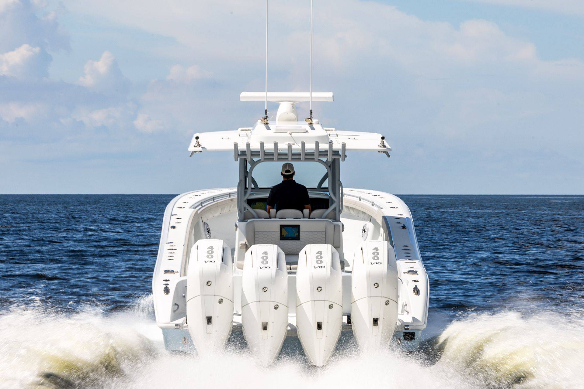 Stern view of the Yellowfin 39 Offshore with four outboards at speed