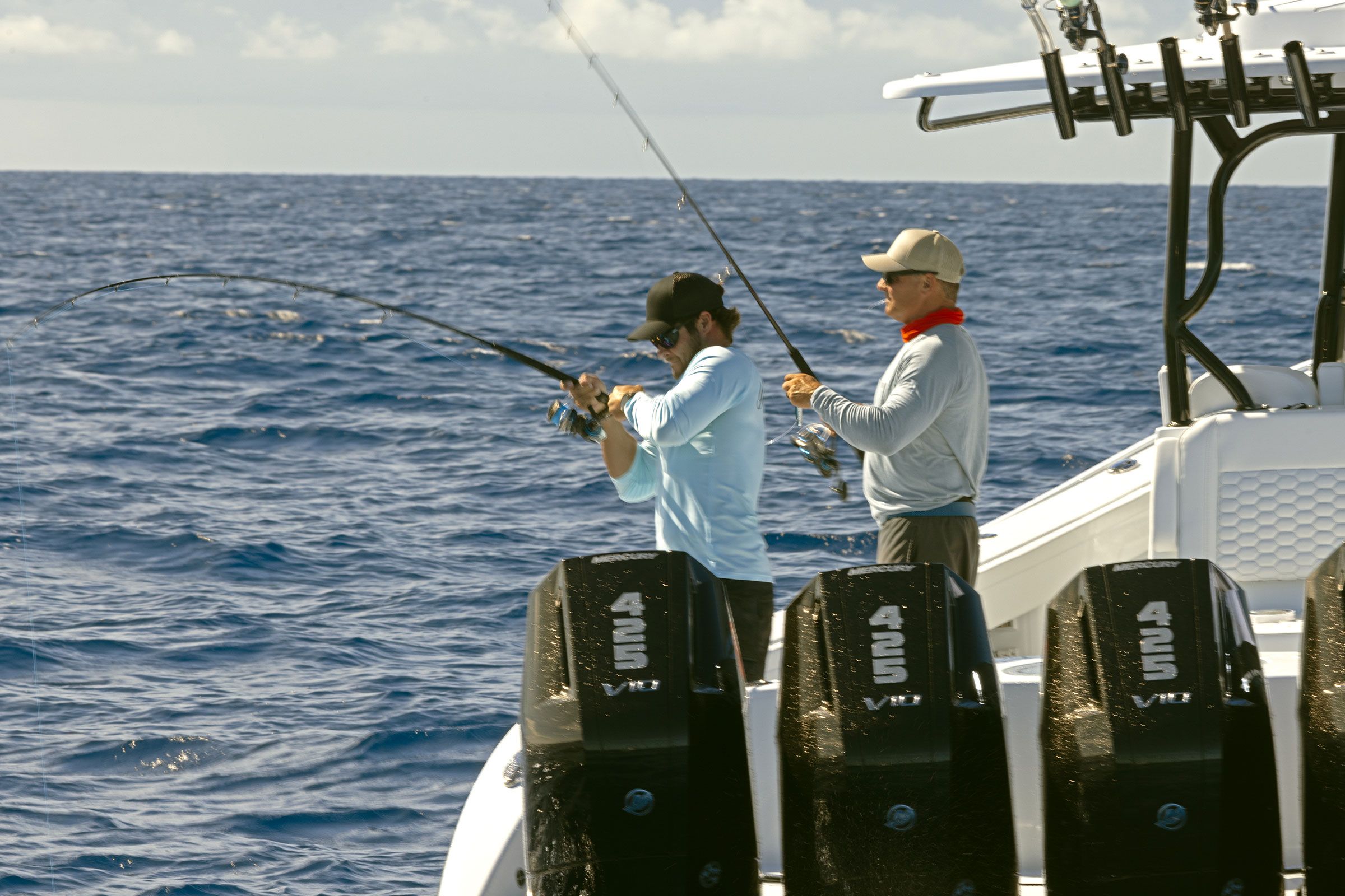 Anglers fishing from the stern of the Yellowfin 39 Offshore beside its outboards