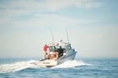Anderson 31 pilothouse running away from the camera with crew in the cockpit
