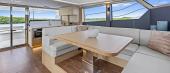 Aquila 50 Yacht salon with U-shaped seating and panoramic windows