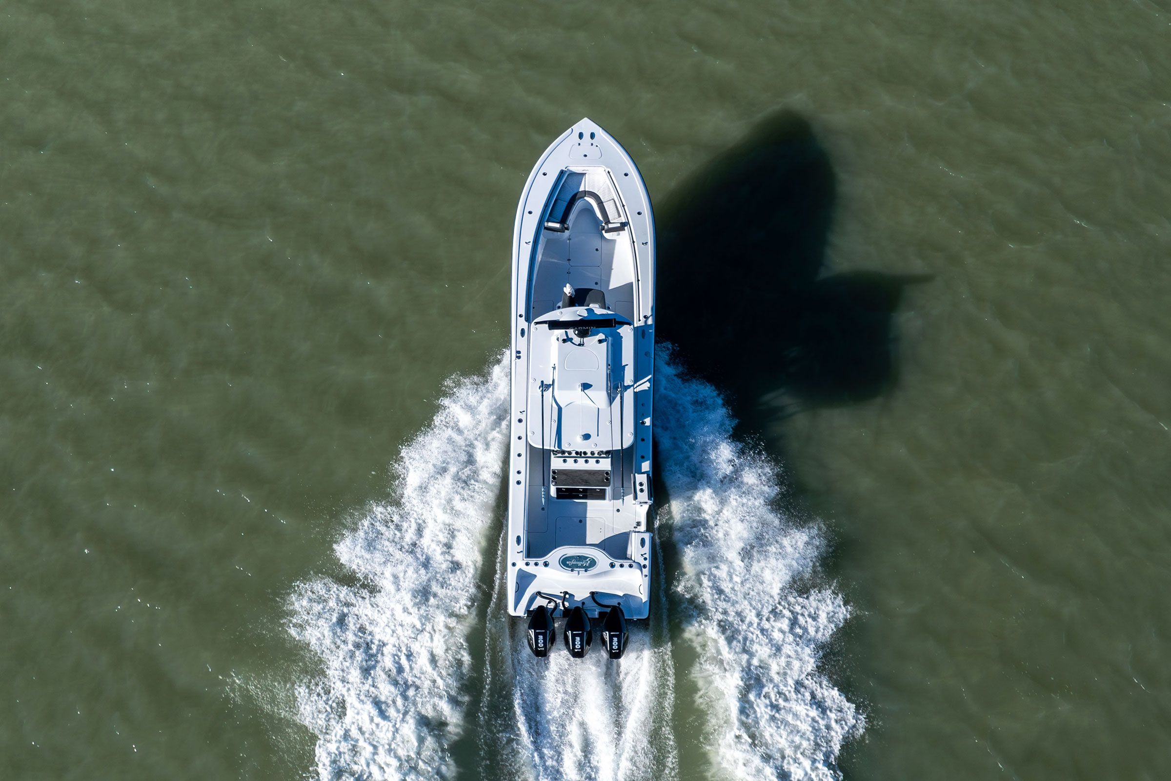 Top-down aerial view of the Yellowfin 36 Offshore leaving a wide wake