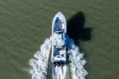 Top-down aerial view of the Yellowfin 36 Offshore leaving a wide wake