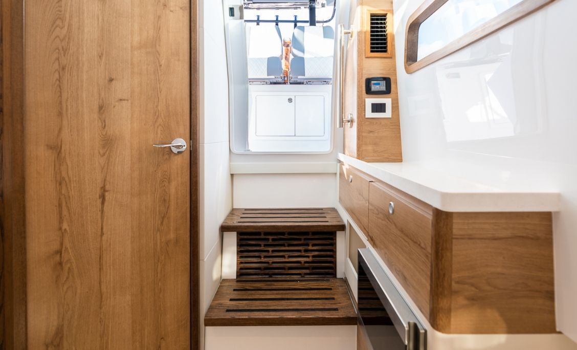 Bertram 39CC head with vanity, wood cabinetry and teak shower grate