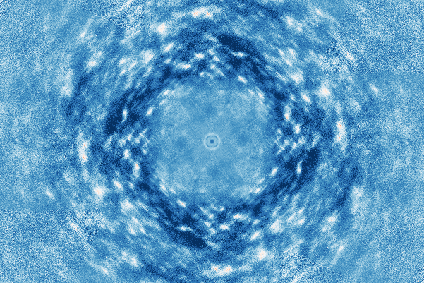Concentric circular ripples surround a small central ring