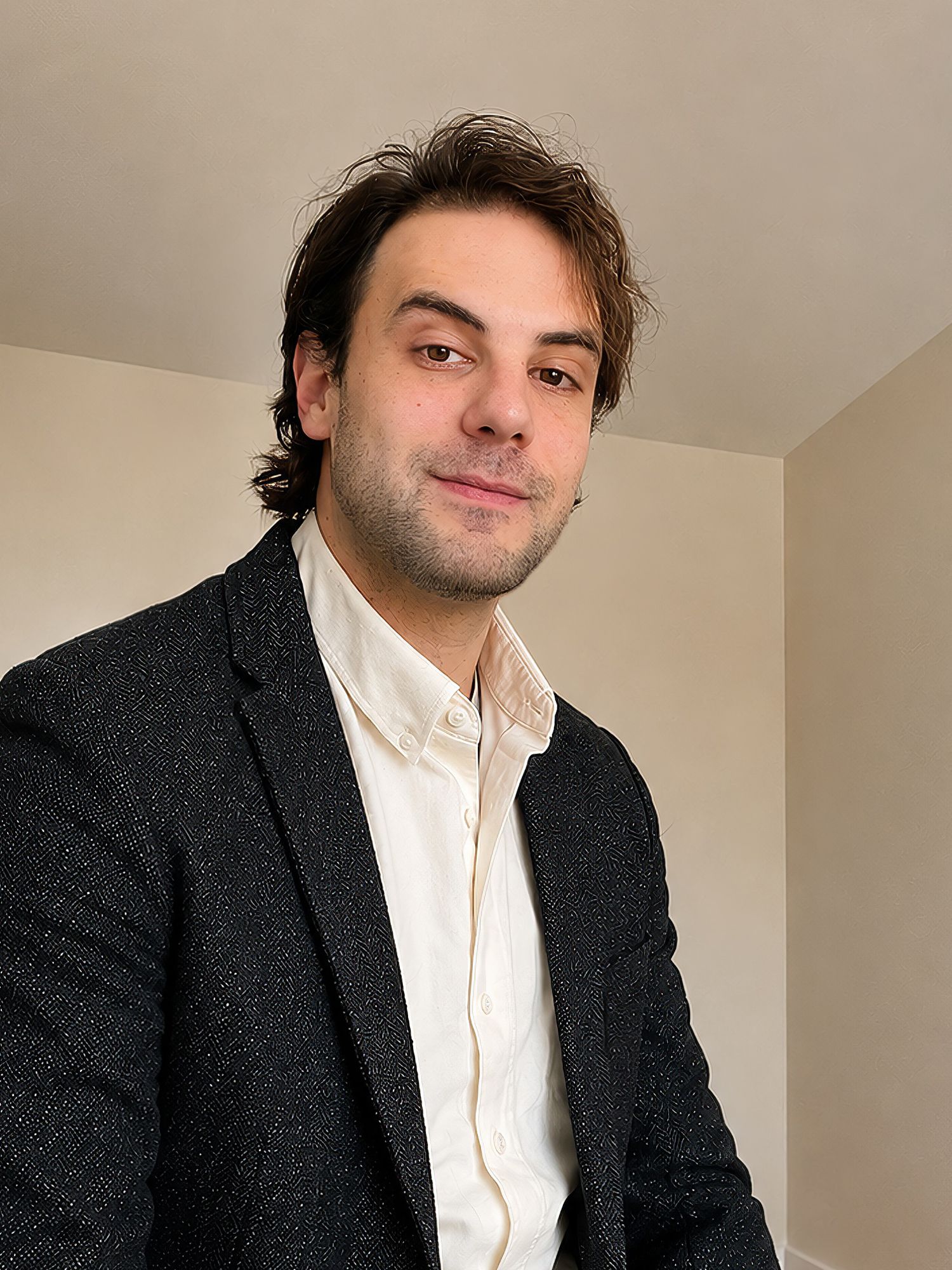 Man wearing a blazer and white shirt