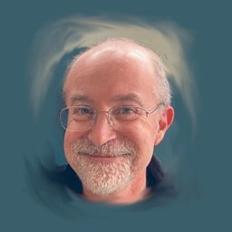 Smiling man with glasses and a gray beard