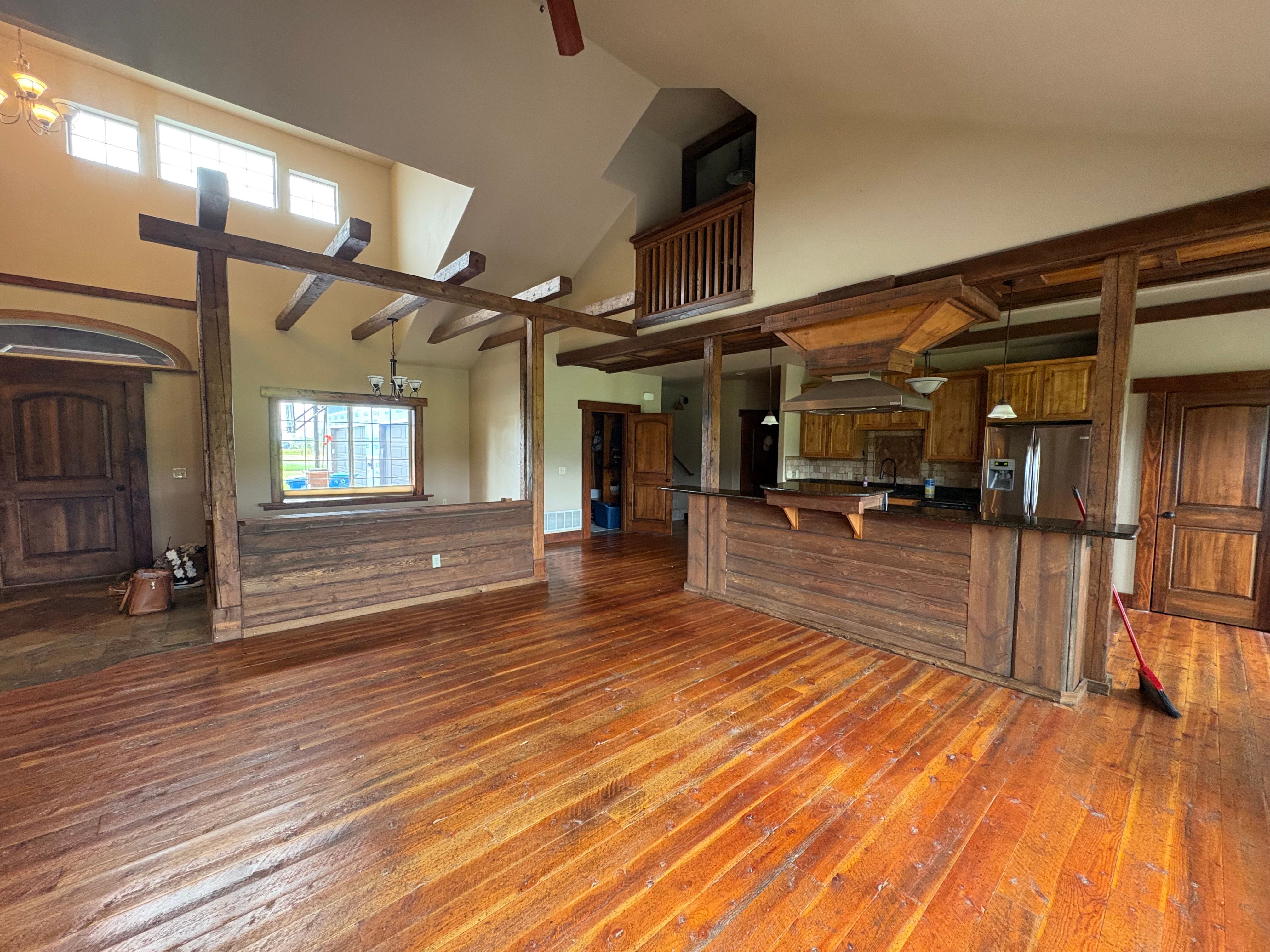 A "before" photo of the kitchen with posts in the island.