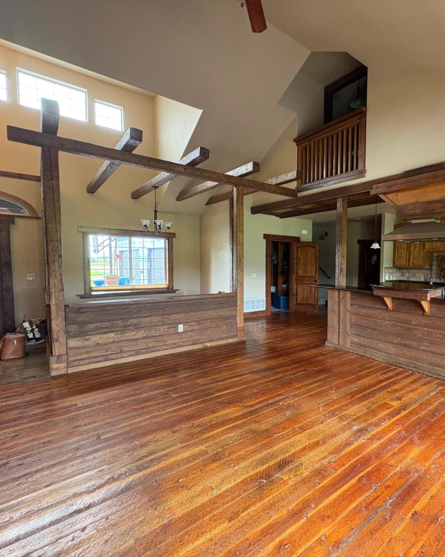 A "before" photo of the kitchen with posts in the island.