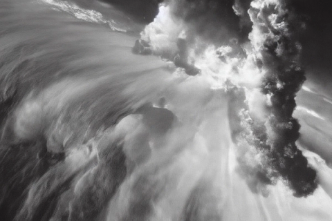 Turbulent water and foam in motion, dramatic monochrome.