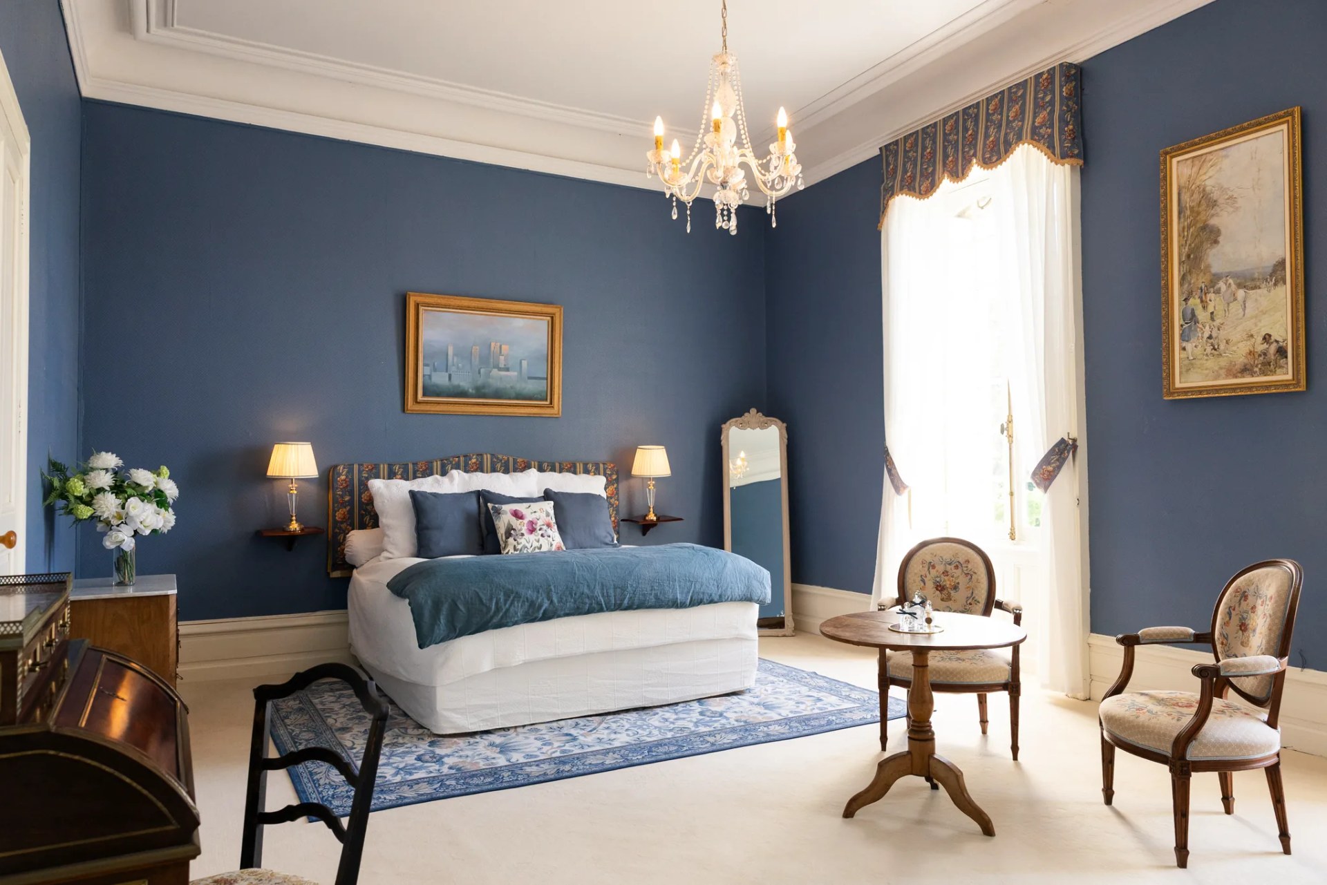 The bridal suite: its bed, chaise longue and crystal chandelier