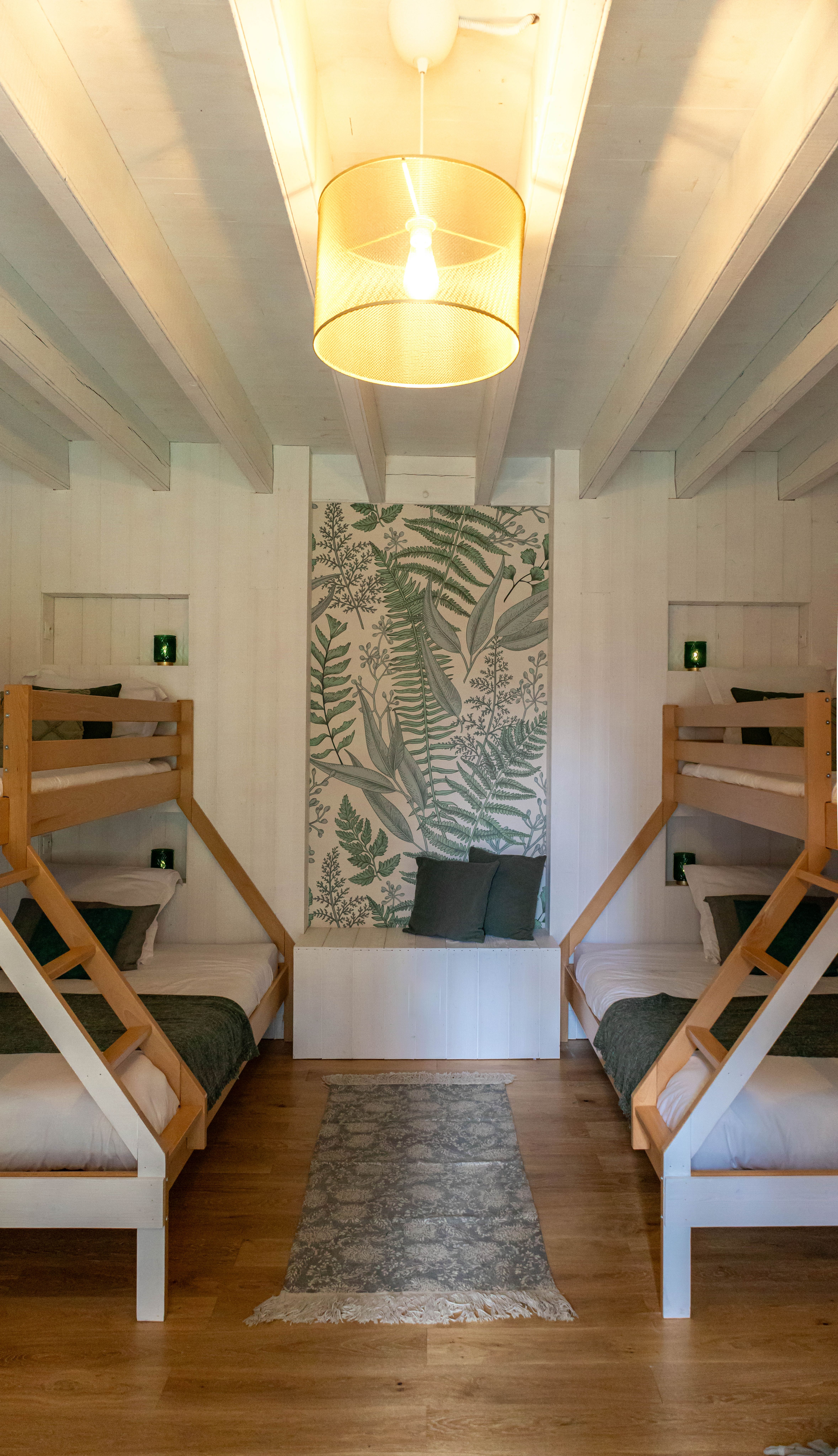 A cottage bedroom, its window and armchair