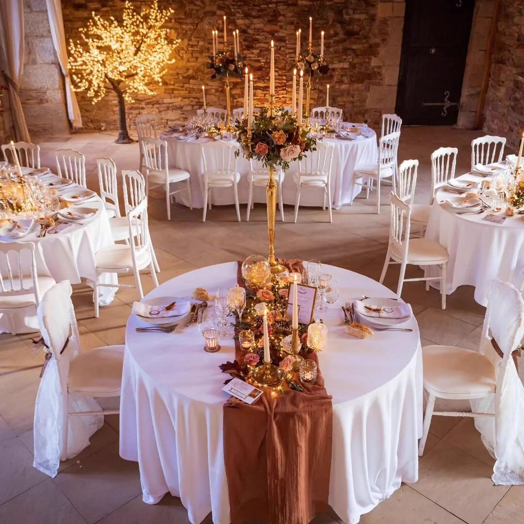 The banqueting hall set in terracotta tones, beneath its original beams