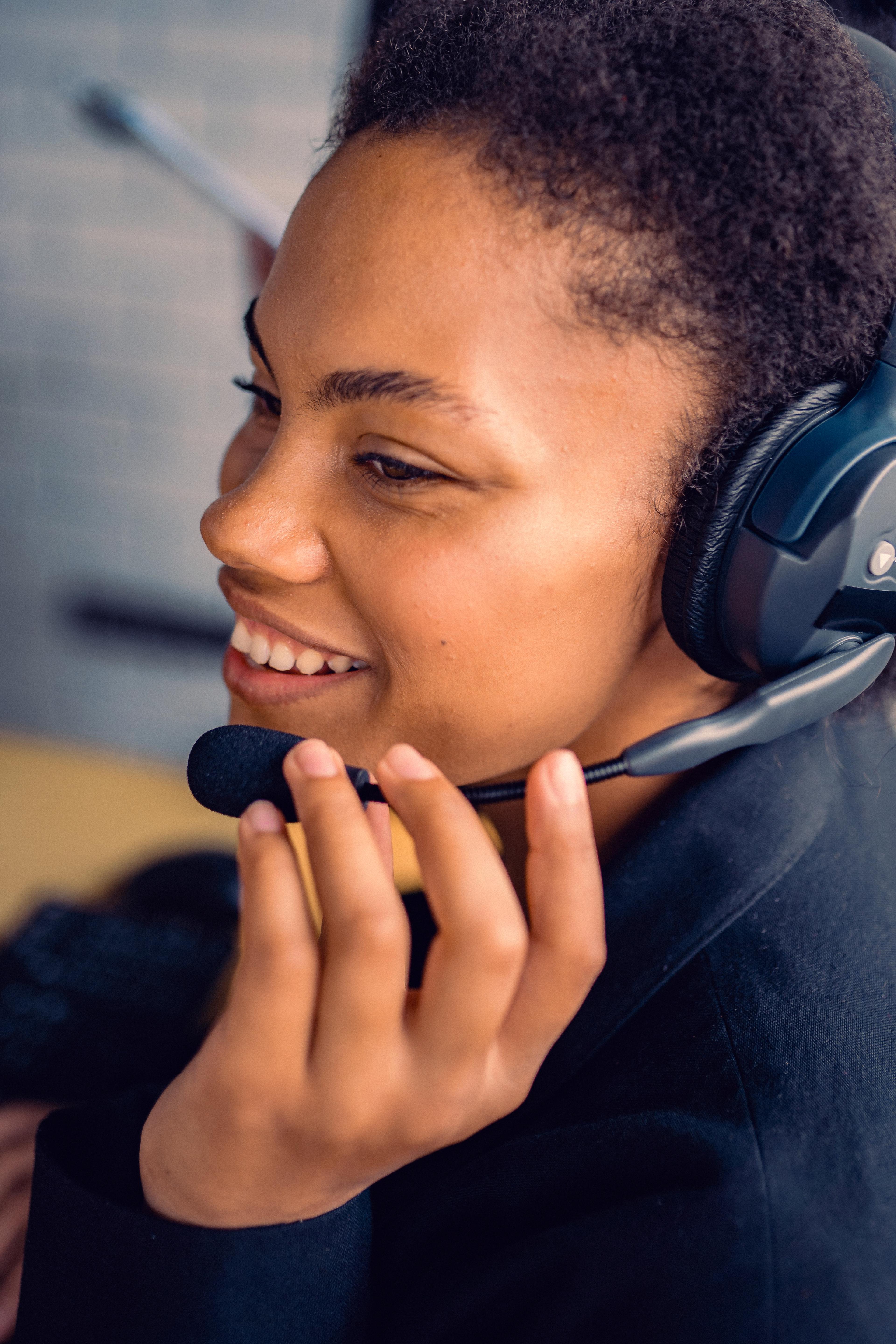 Smiling woman on a call in a headset