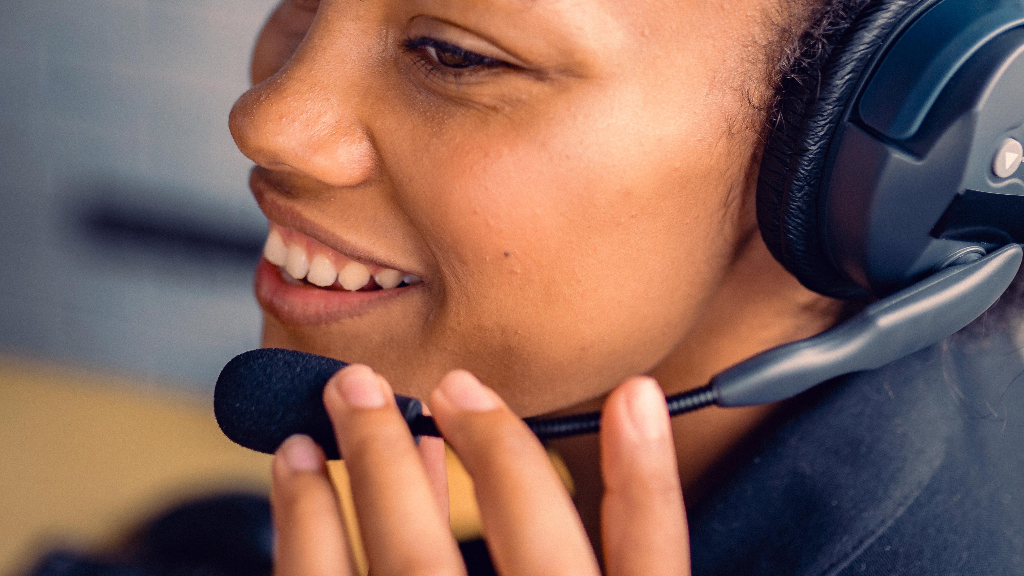 Woman wearing a headset talking