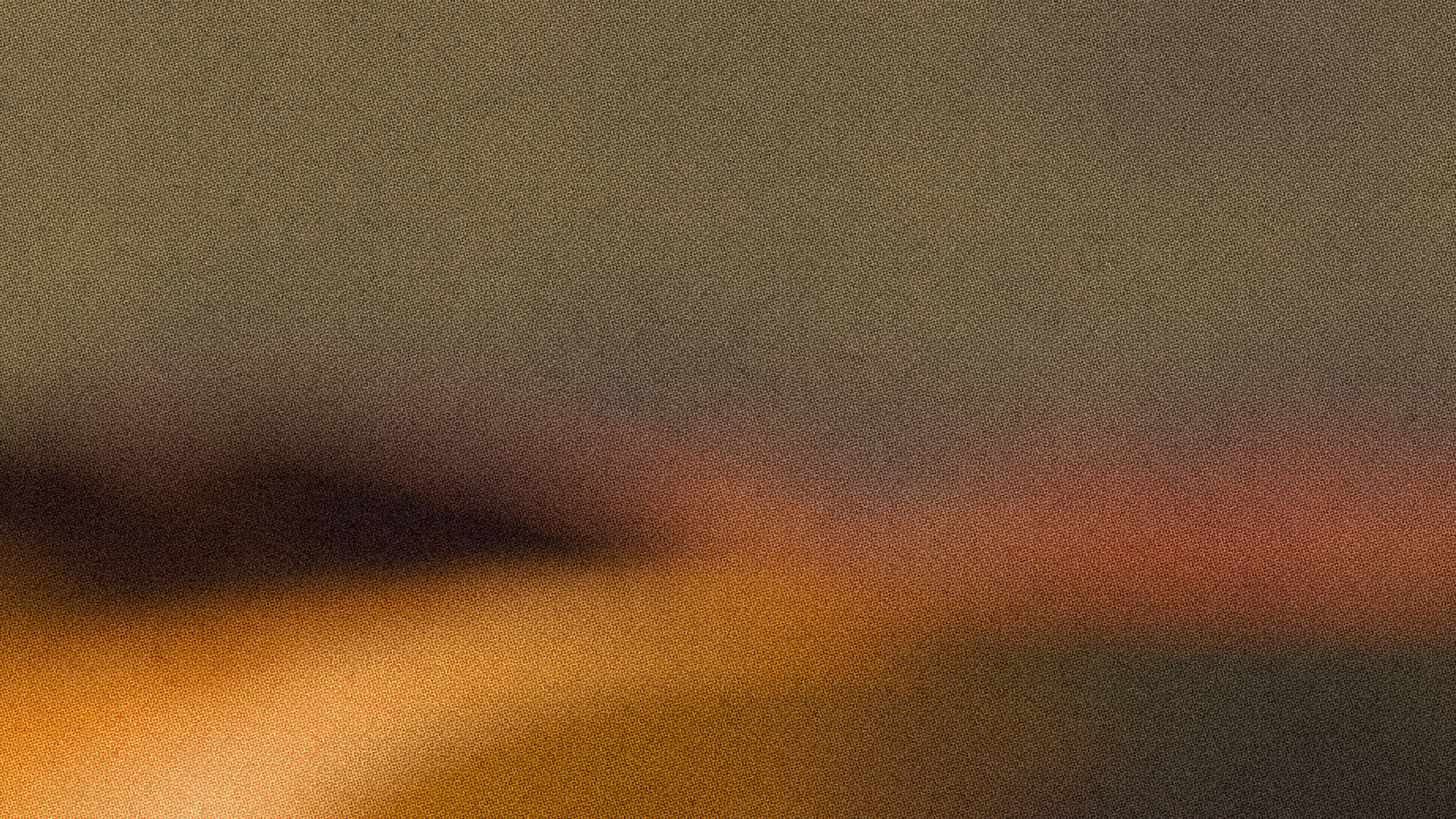 Blurred brown and amber gradient, like a road at dusk