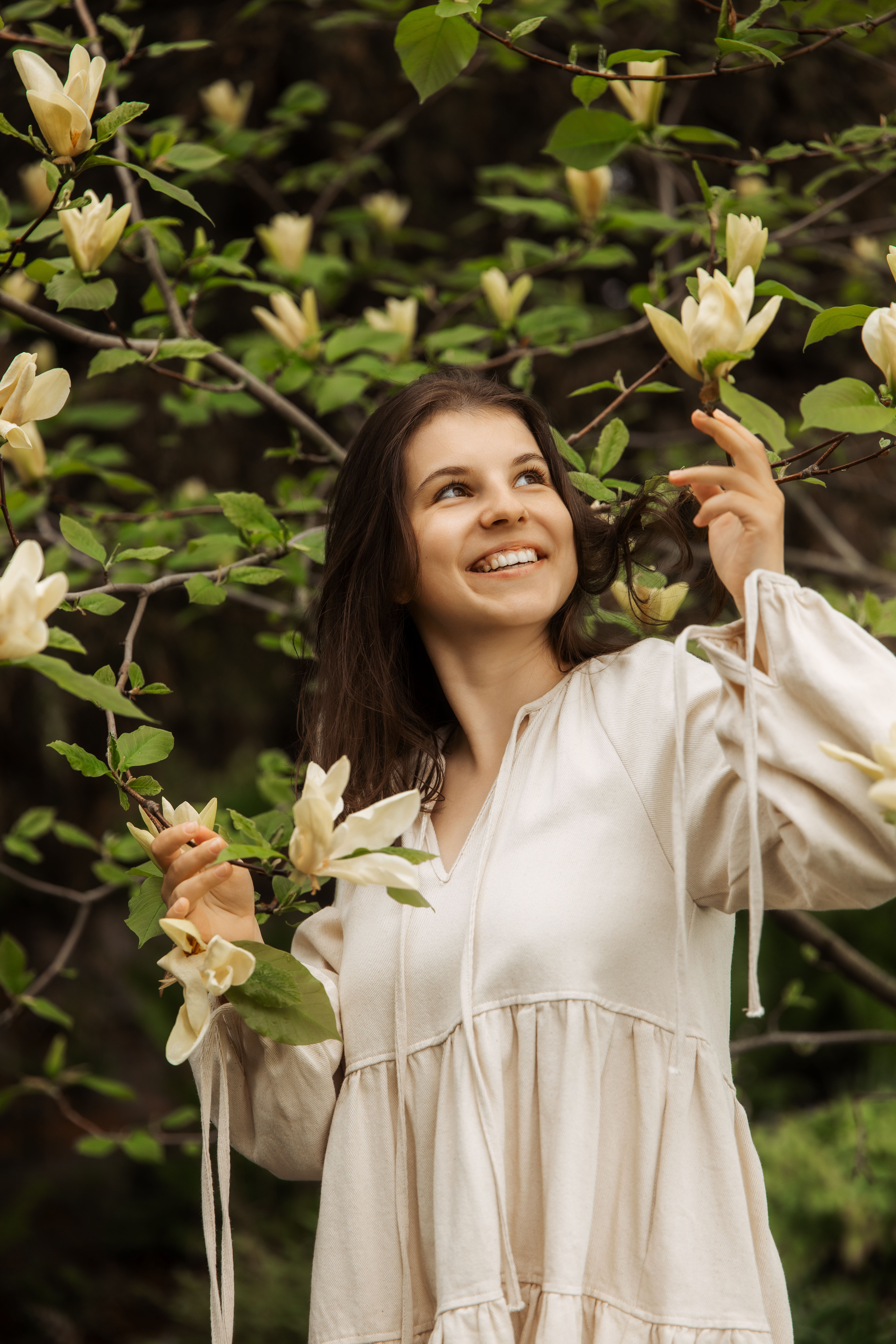Anna in a softly painted woodland setting
