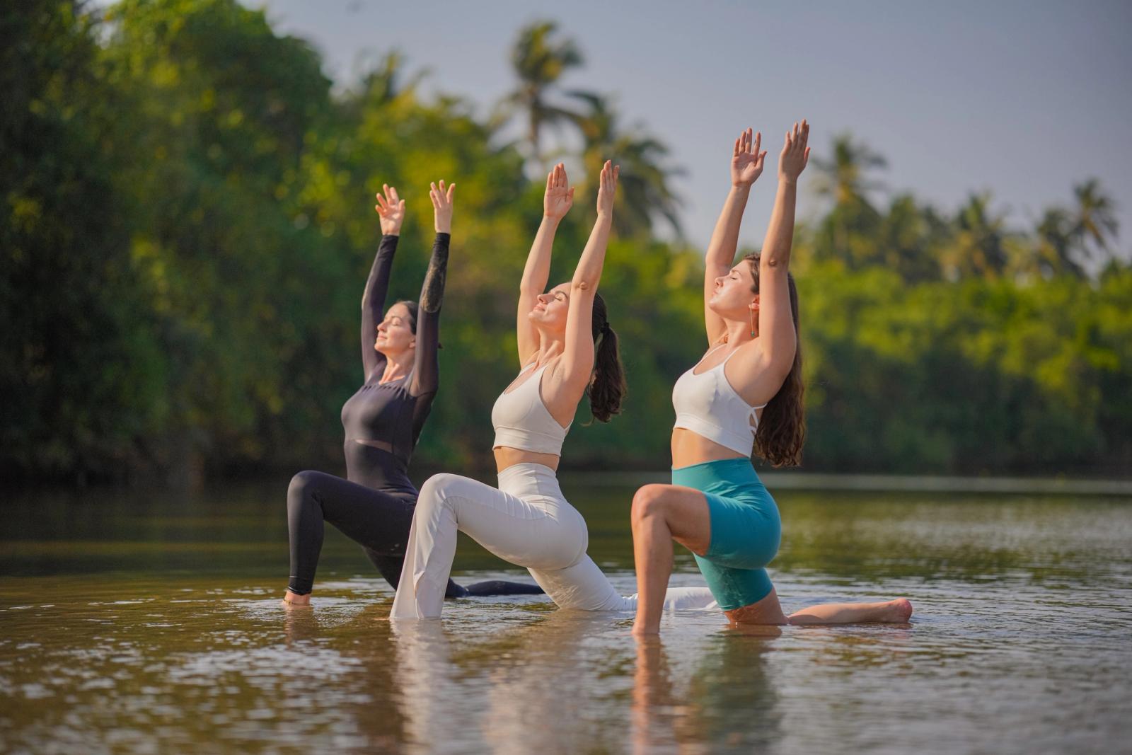 Guest practising yoga at a wellness retreat in Mandrem Goa