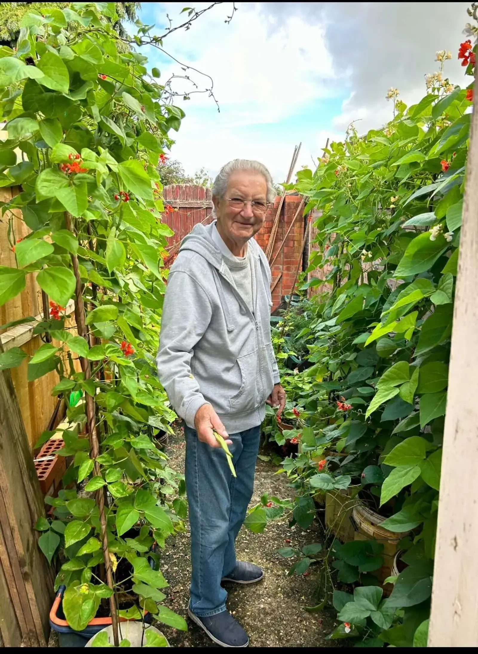 Hayley and her dad Colin sitting on the sofa