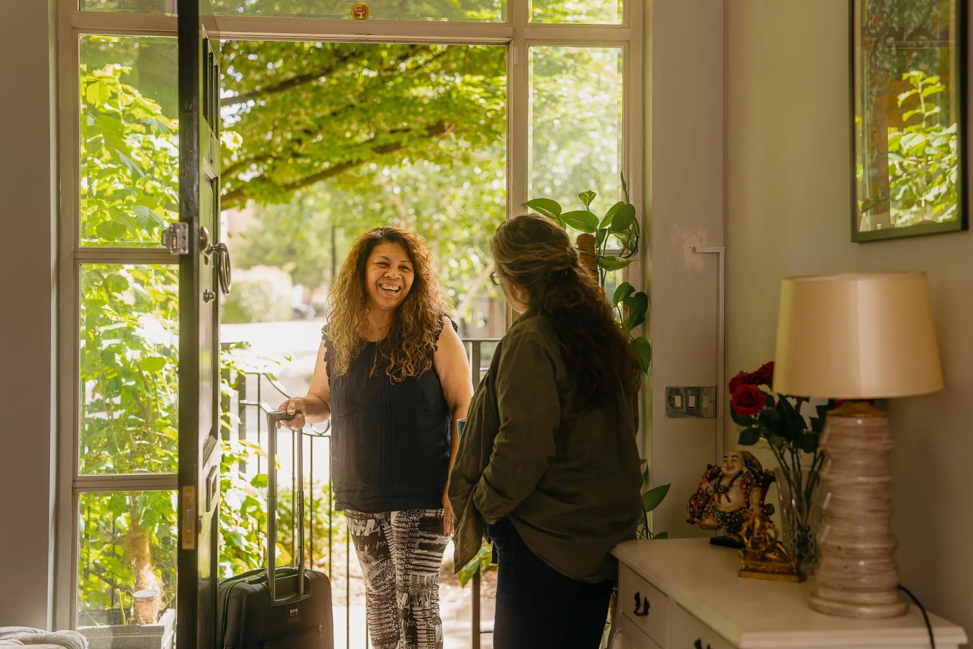 carer arriving at house