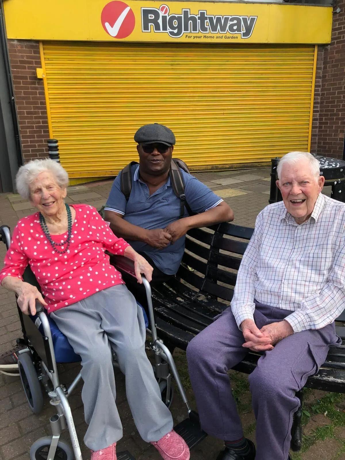 Bob with his wife and his carer Godswill