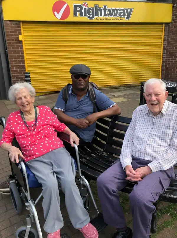 Bob with his wife and his carer Godswill