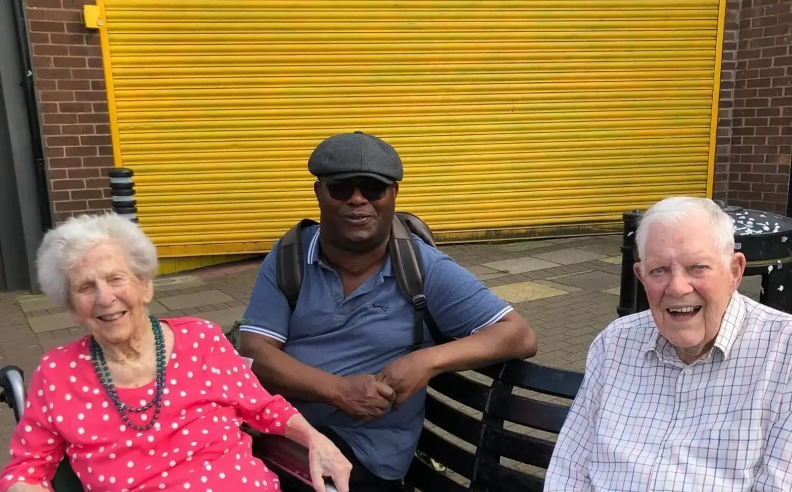 Bob with his wife and his carer Godswill