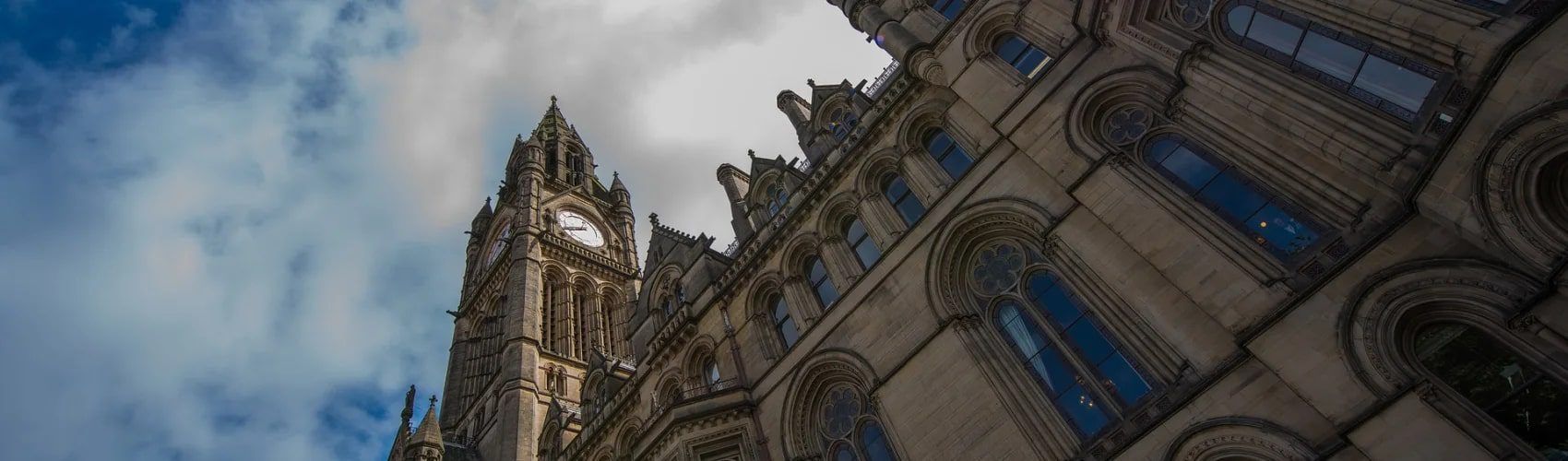 Low-angle view of Manchester Town Hall's Gothic clock tower