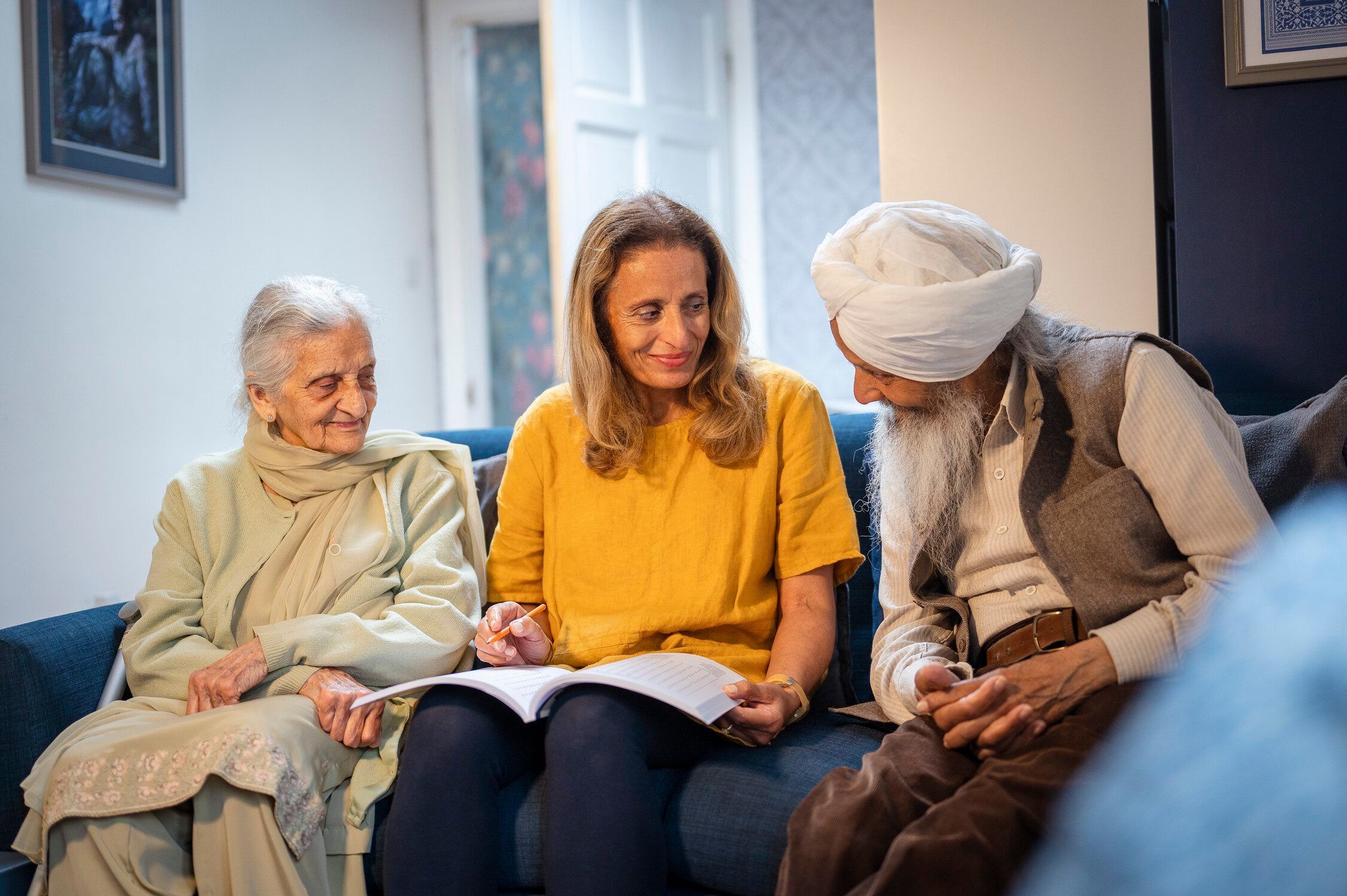 Three elderly people hanging out in a sofa