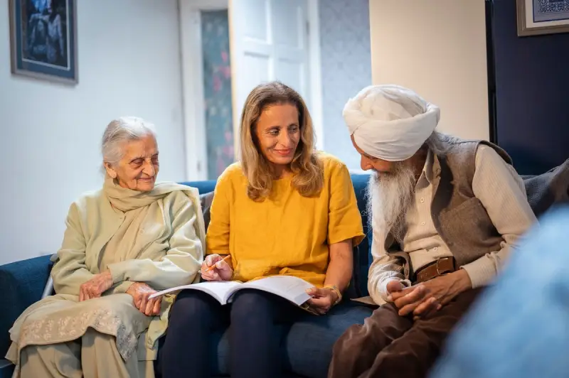 Three elderly people hanging out in a sofa